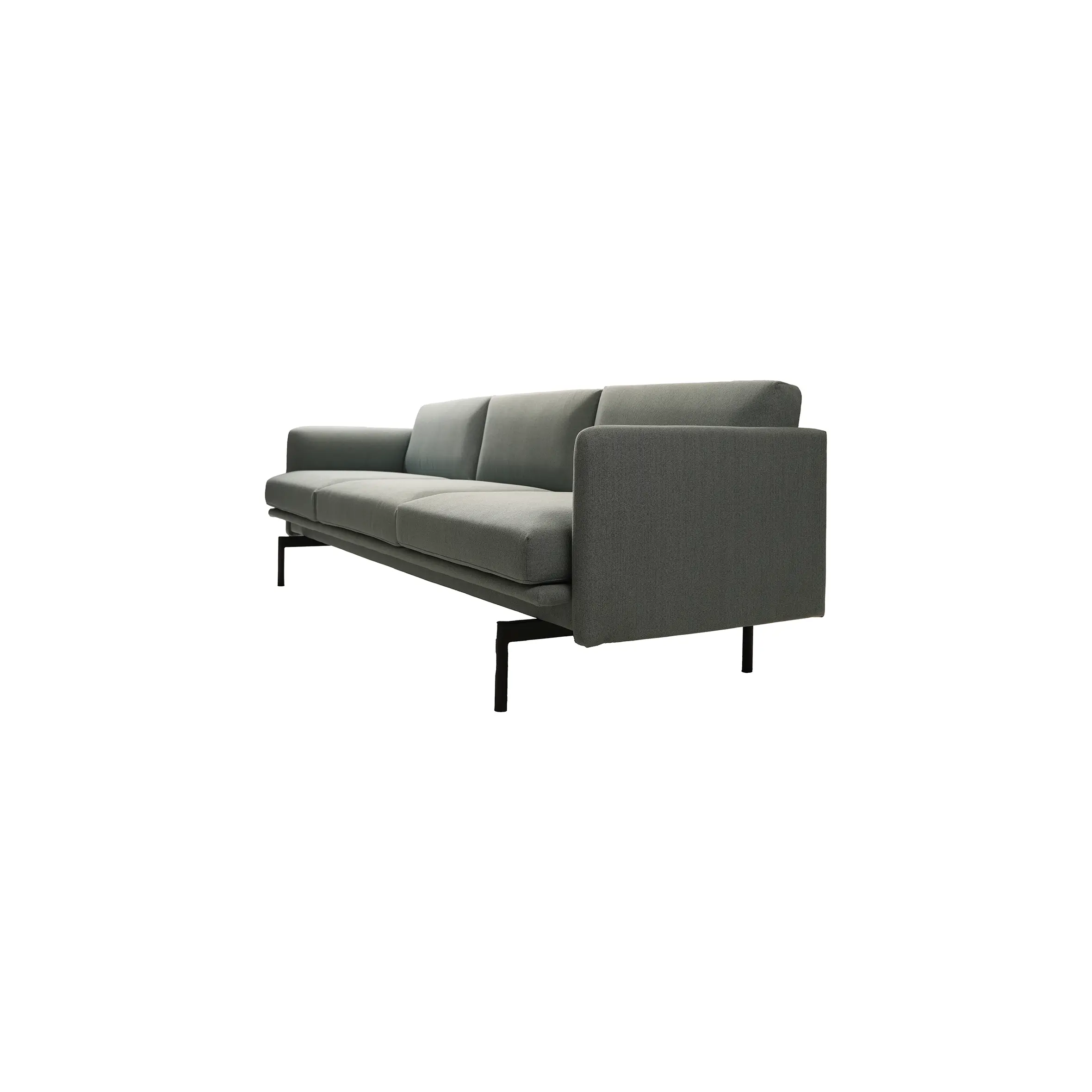 Modern office space with a dark gray sofa, oval wooden coffee table, and white office chair by a wooden desk. Minimalist and sleek atmosphere.