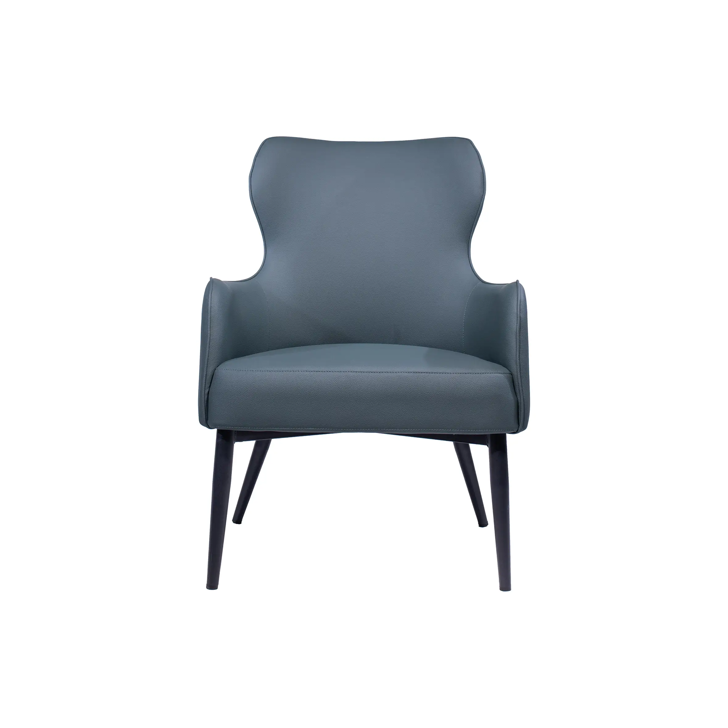 Modern office space with two dark gray armchairs facing a round black table. Background features white desks and office chairs near large windows.