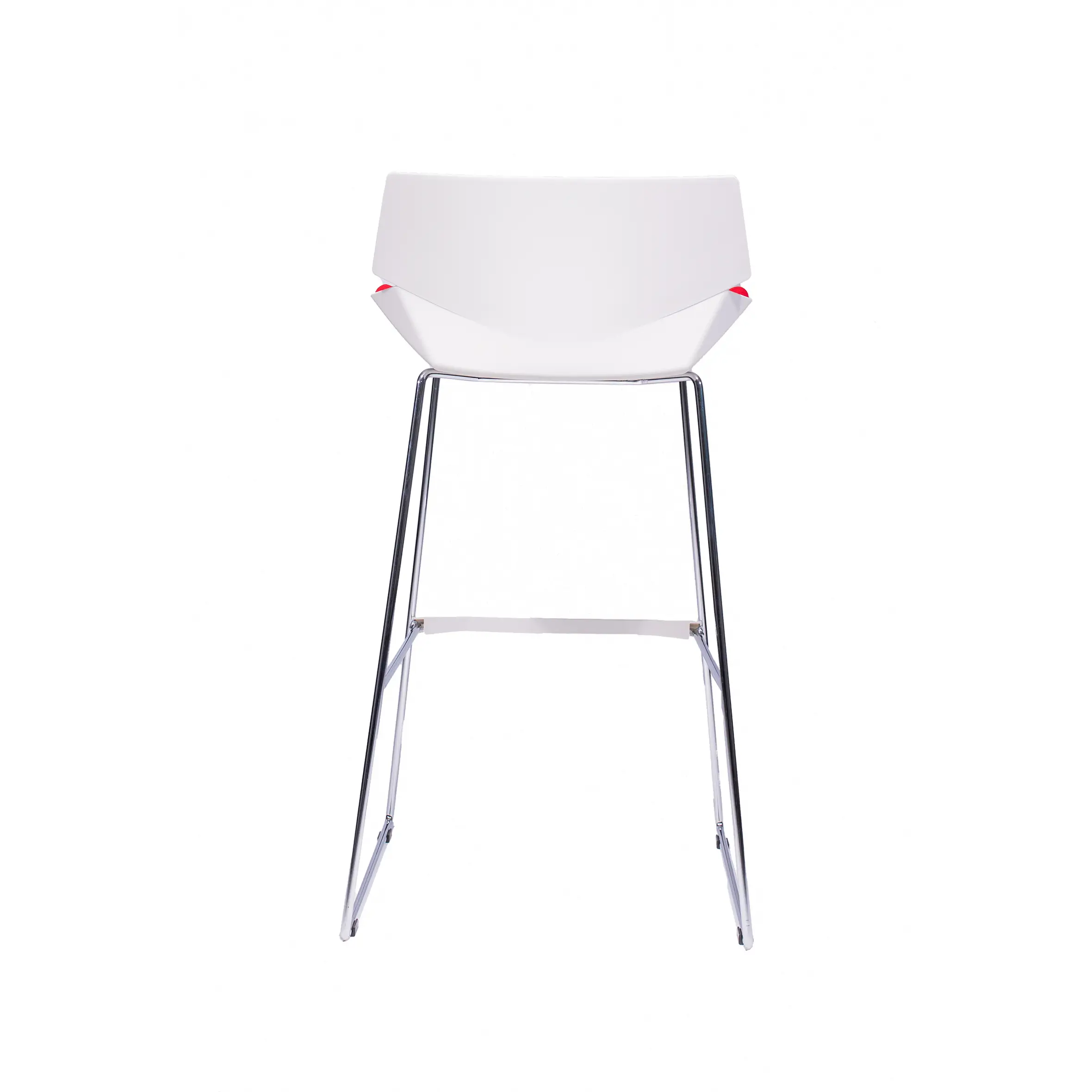 Modern office interior with large windows, a tall, light wood counter, and a red and white chair. Workstations with black chairs and plants in the background.