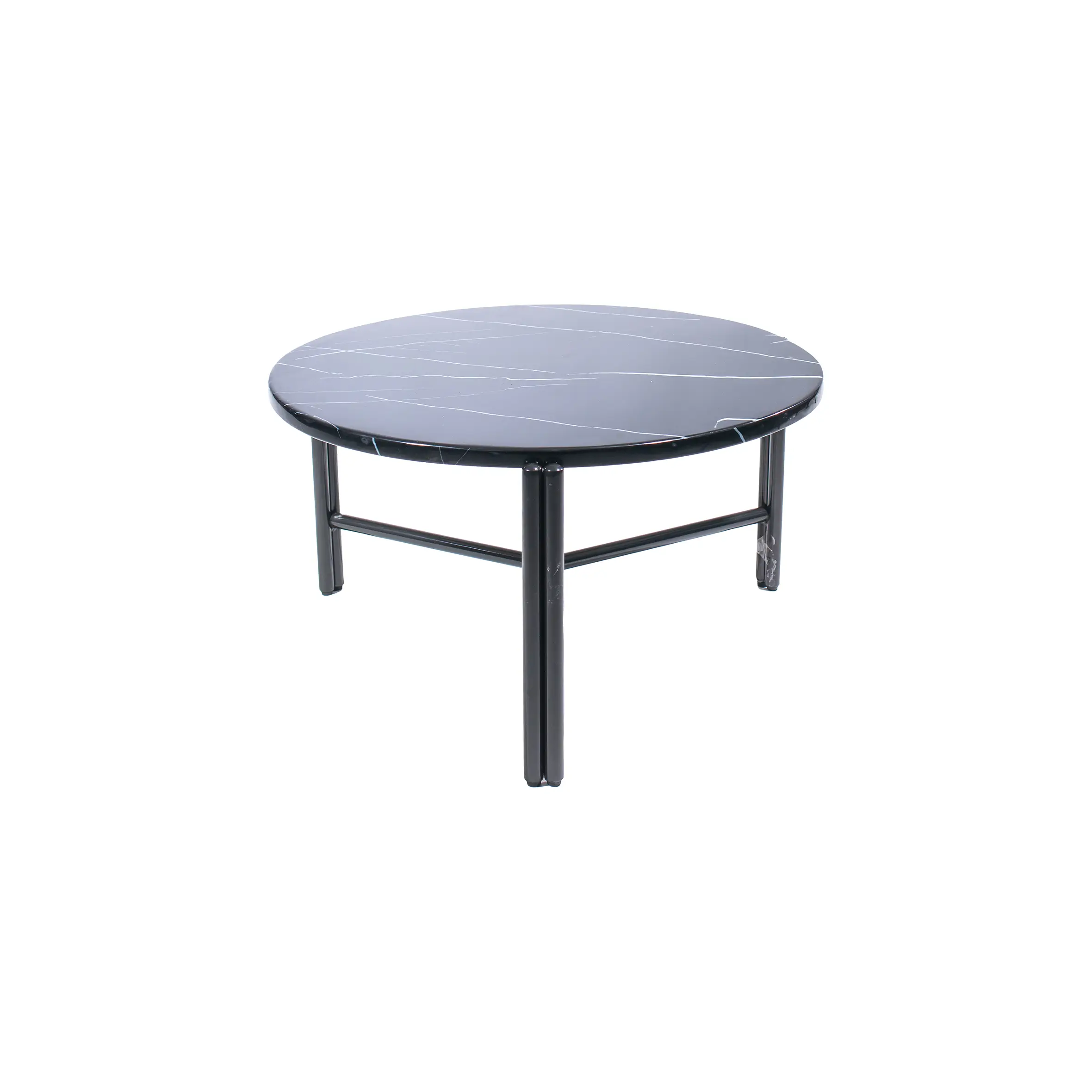 Modern office lounge with a sleek black round coffee table centered between two gray armchairs. Desks with chairs are visible in the background.