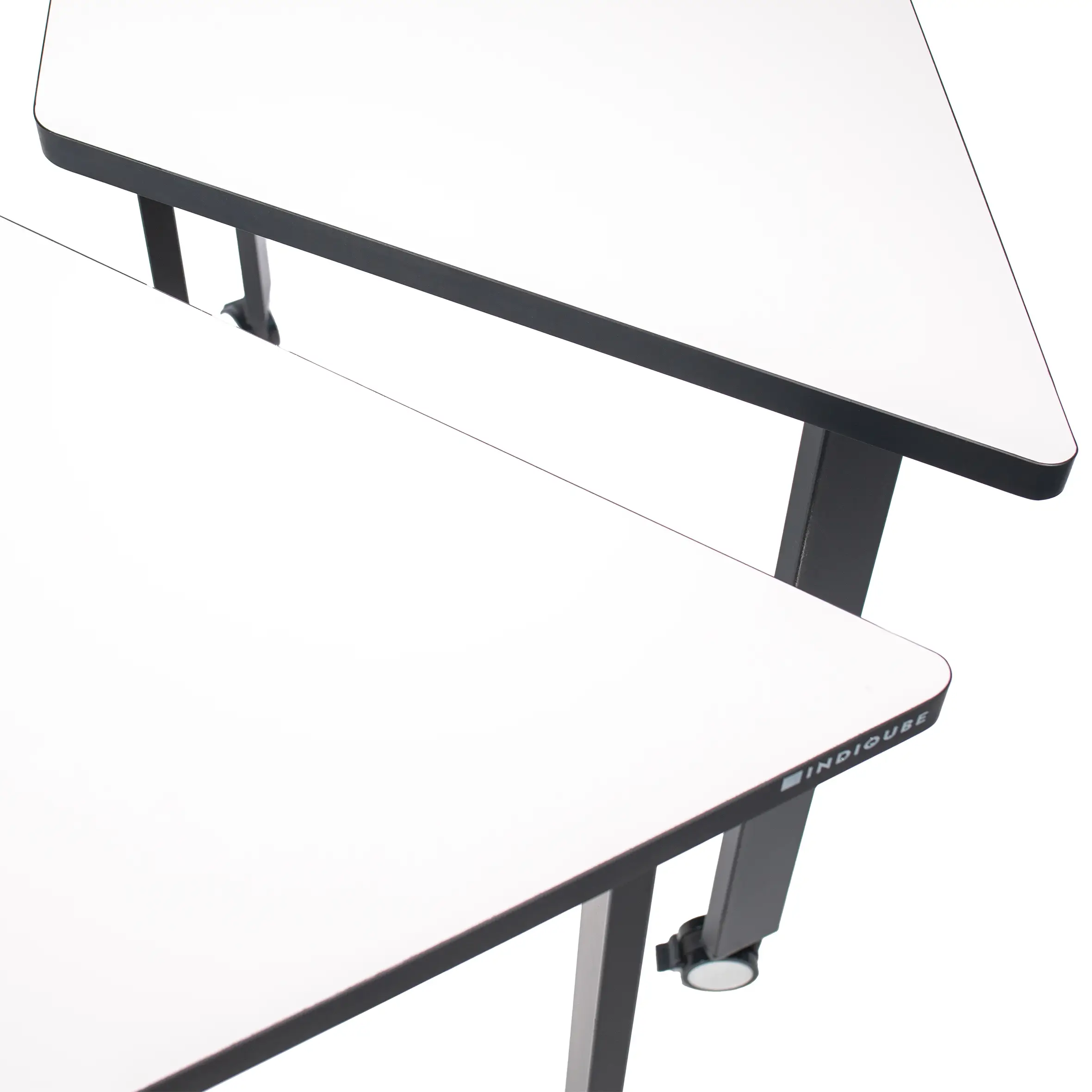 Modern office setting with a trapezoidal white desk and a black mesh swivel chair on wheels. Neutral tones and a bright window create a minimalist, professional vibe.