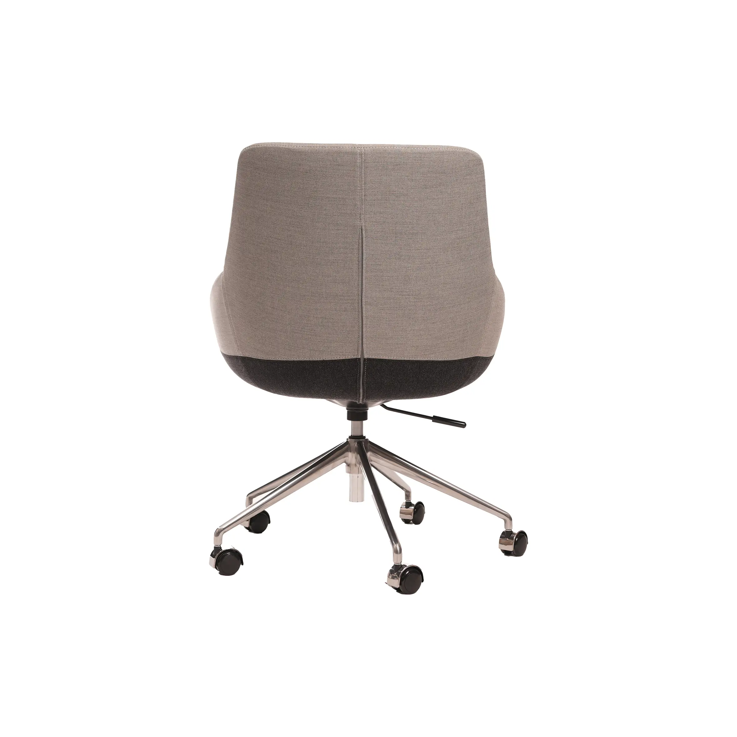 Modern office space with wooden L-shaped desk, gray swivel chair, and open laptop. A green plant adds a touch of nature. Large window view outside.