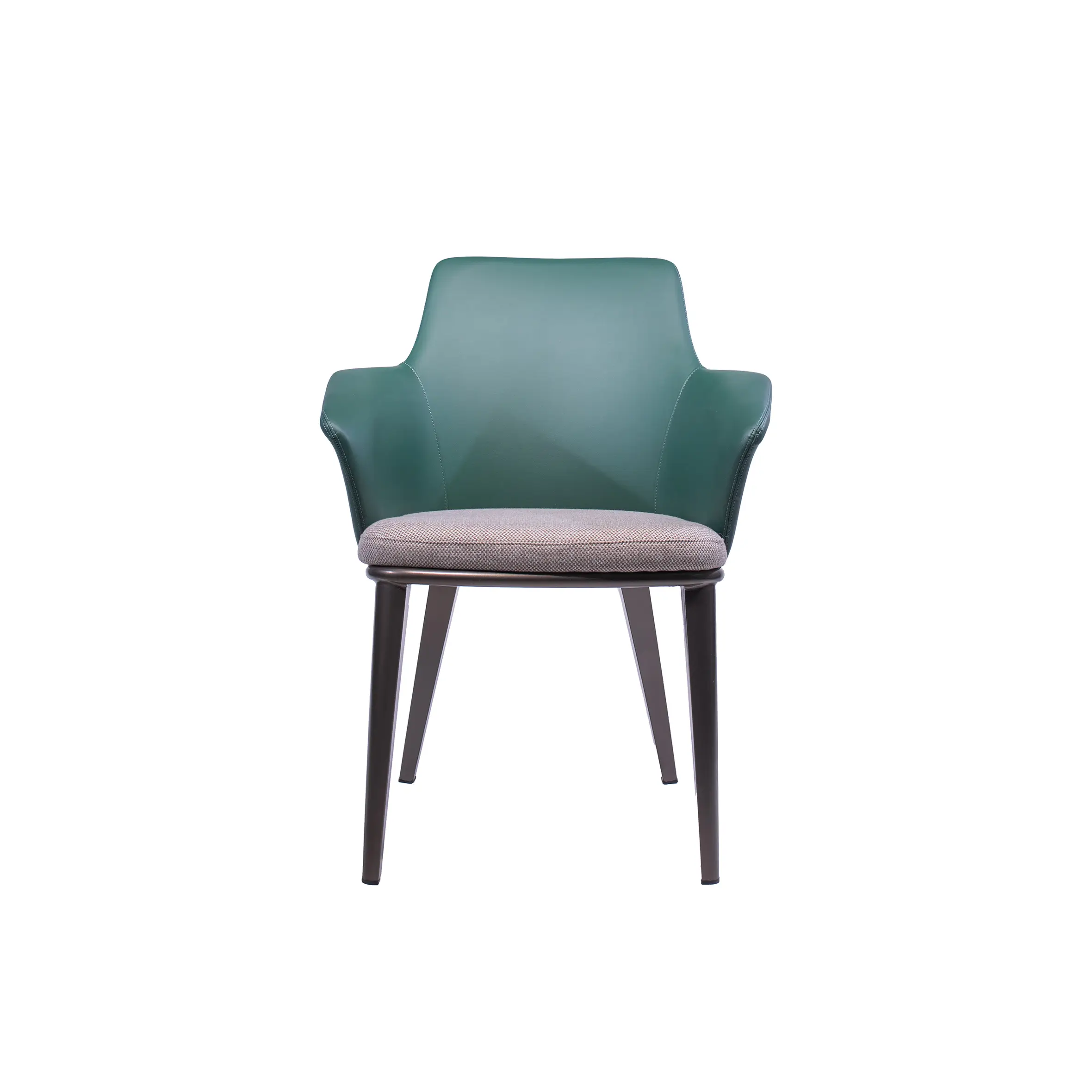 Green armchair with a gray cushion beside a wooden side table on a carpeted floor. Background shows a modern lounge with large windows and a sofa.