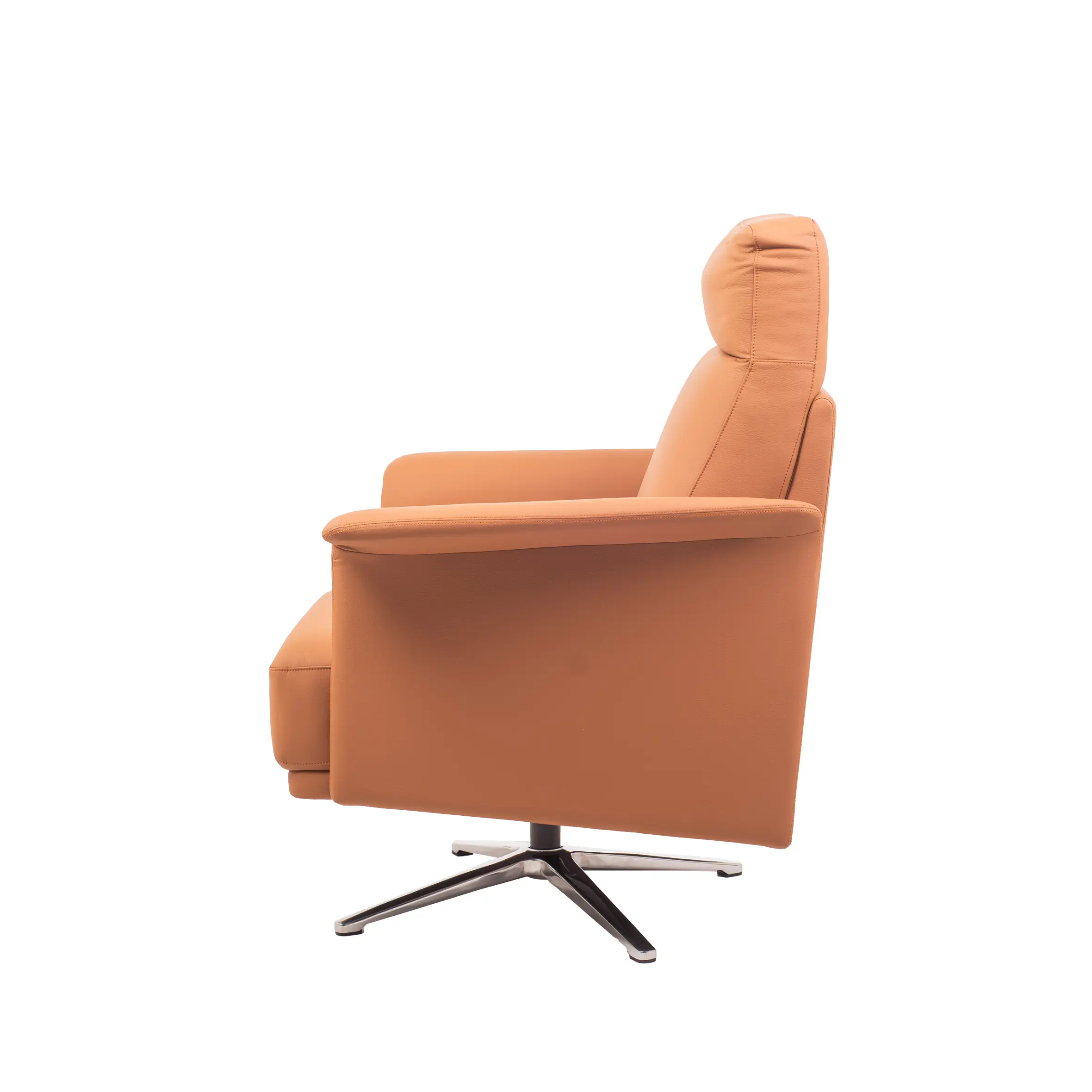 A modern office features a comfortable orange armchair on a light rug, with a sleek desk, computer, chair, and green plants in the sunny background.