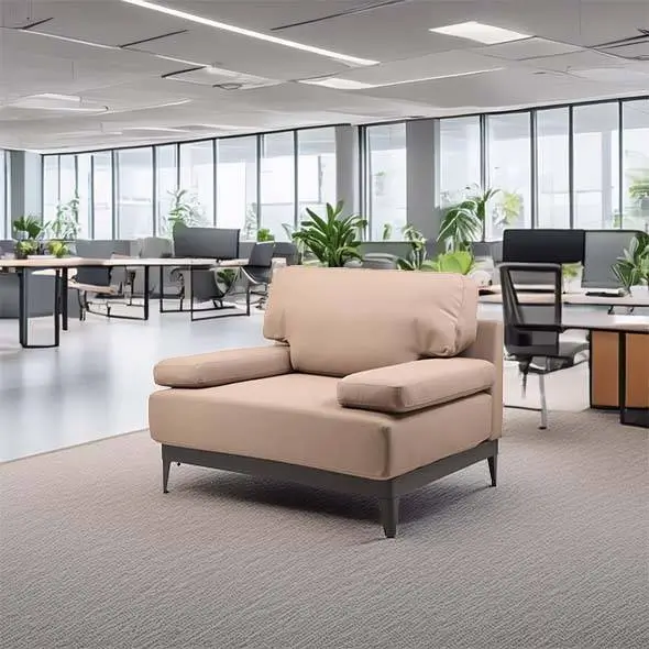 A spacious, modern office with large windows, gray carpet, and soft lighting. A beige sofa is central, surrounded by desks, chairs, and plants.