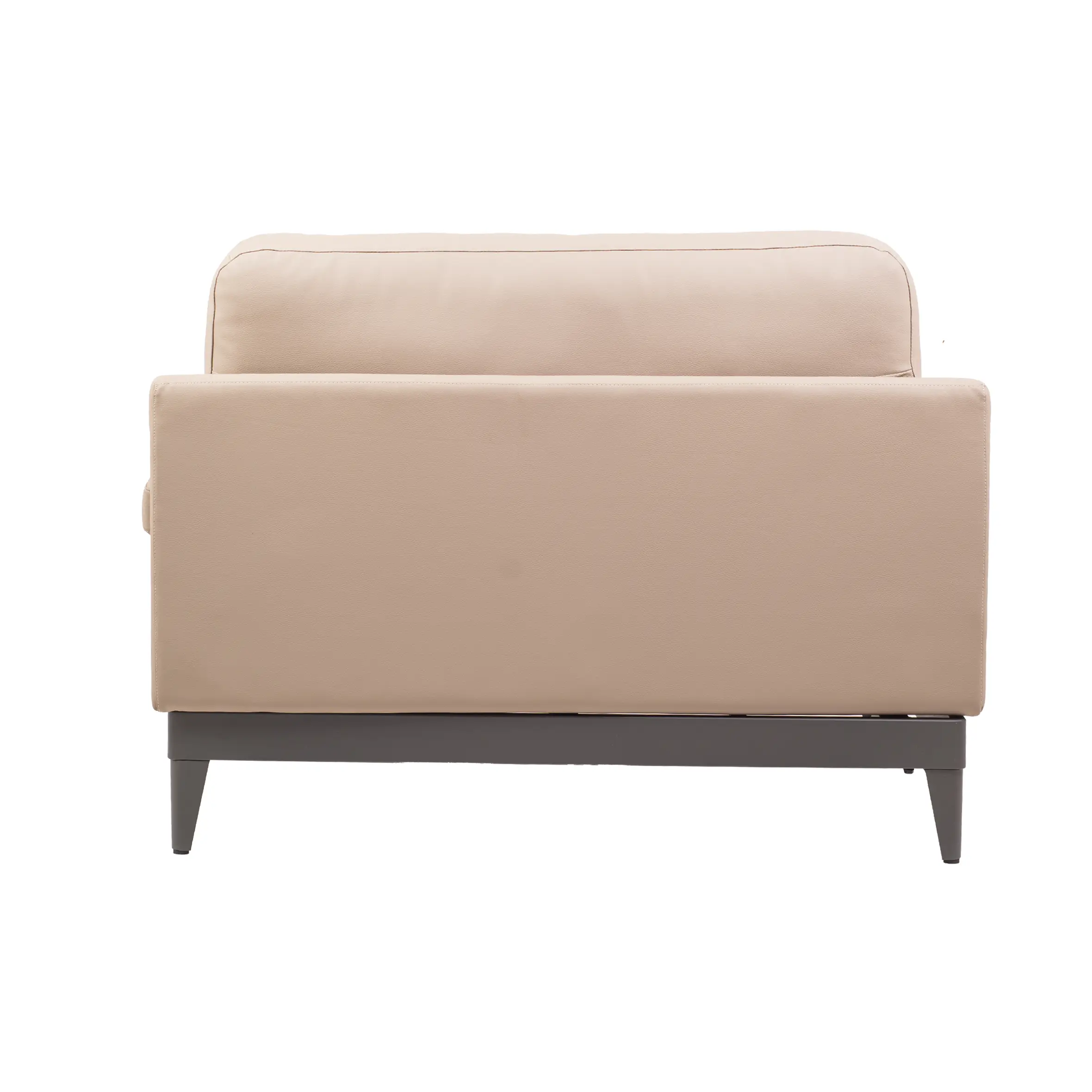 A spacious, modern office with large windows, gray carpet, and soft lighting. A beige sofa is central, surrounded by desks, chairs, and plants.