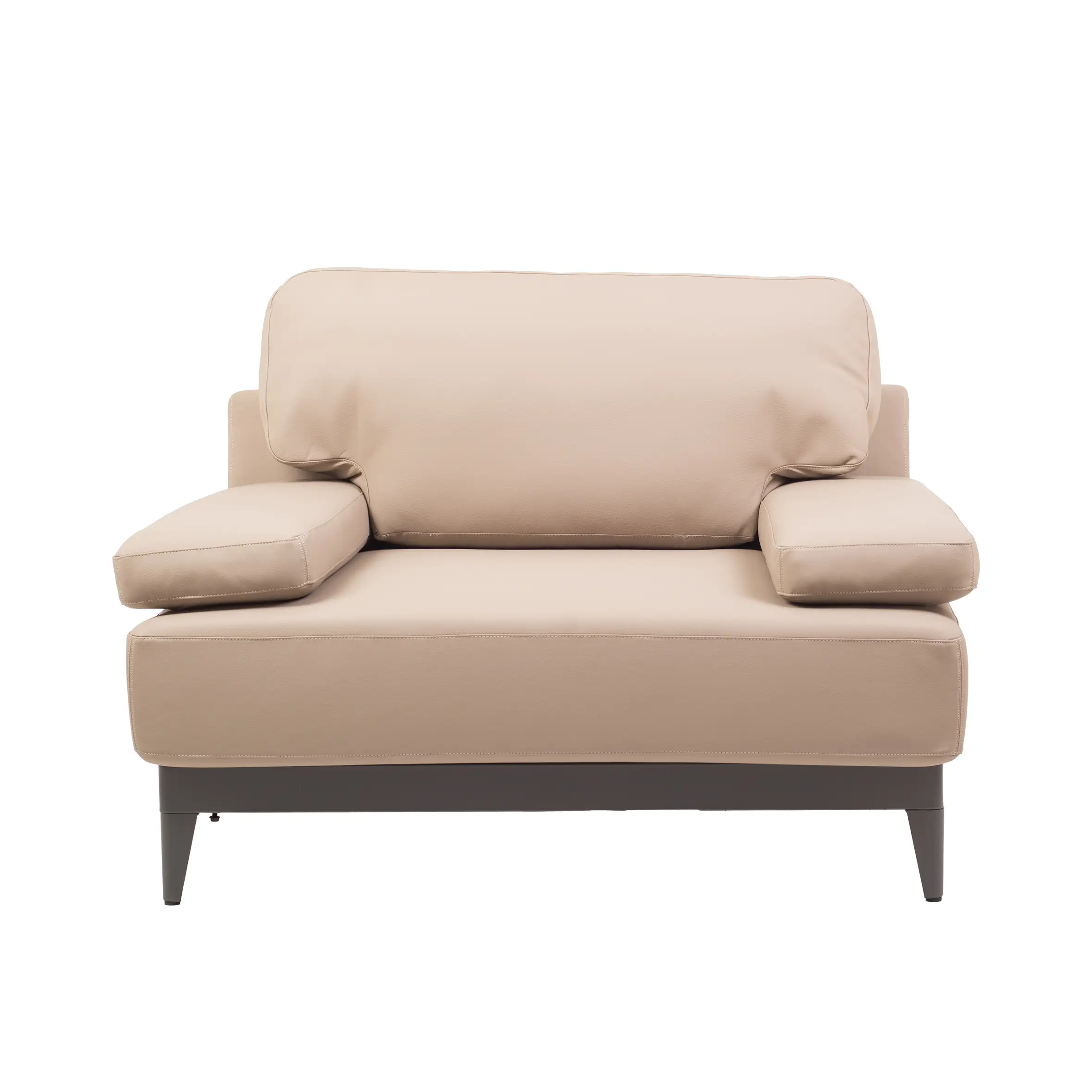 A spacious, modern office with large windows, gray carpet, and soft lighting. A beige sofa is central, surrounded by desks, chairs, and plants.