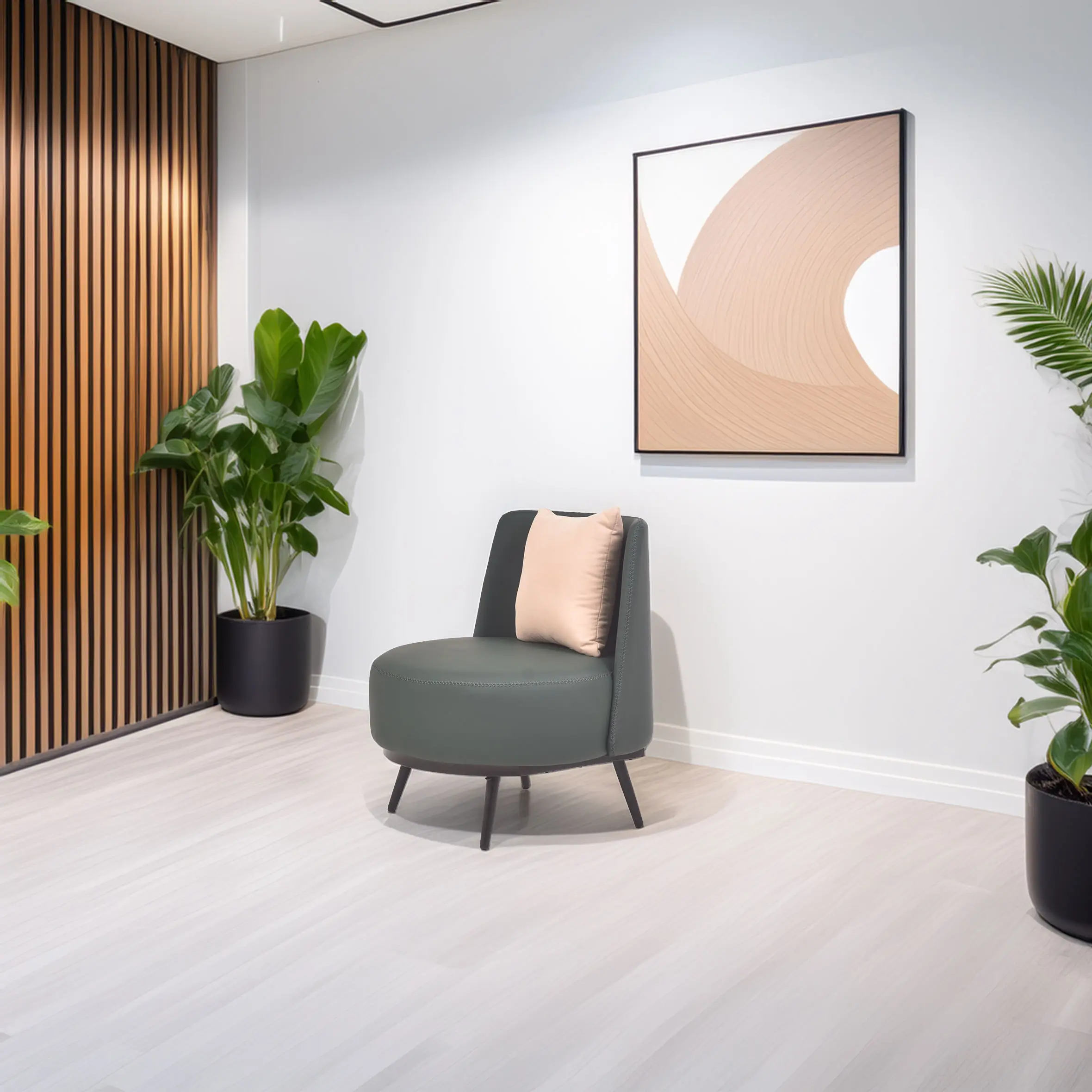 Modern room with a green chair and beige cushion. Abstract art hangs on a white wall. Wooden paneling and green plants add a calming touch.