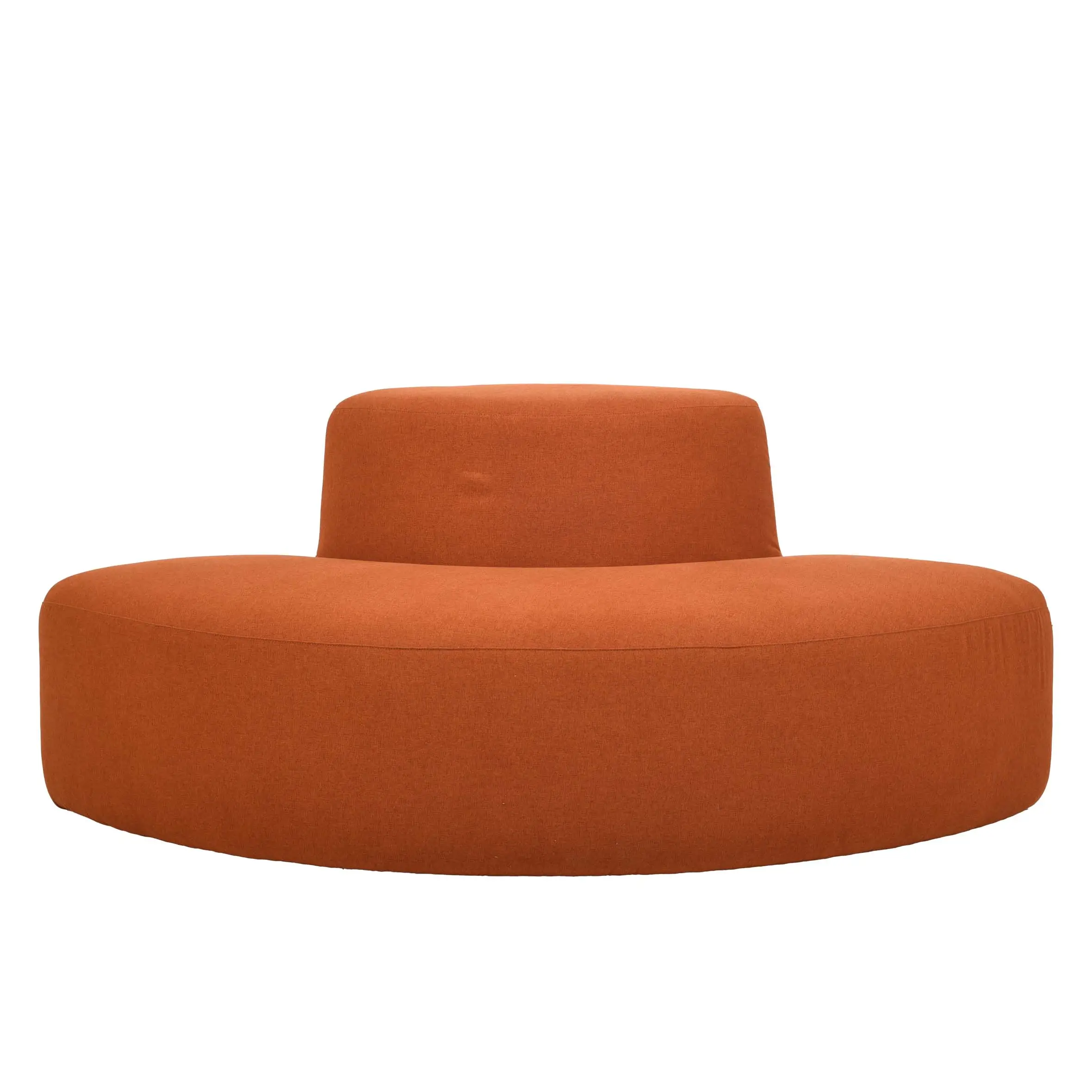 Spacious modern office with large windows, lush green plants, and wooden ceilings. Features a curved orange sofa and wood desks with gray chairs.