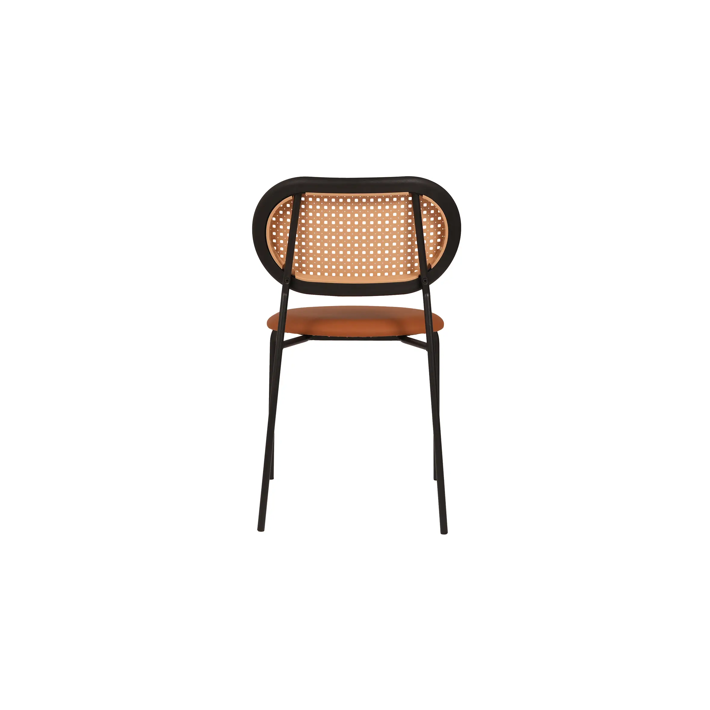 Modern cafe with wooden flooring, featuring a black marble-top table and a brown chair with a woven backrest. Minimalist and inviting atmosphere.