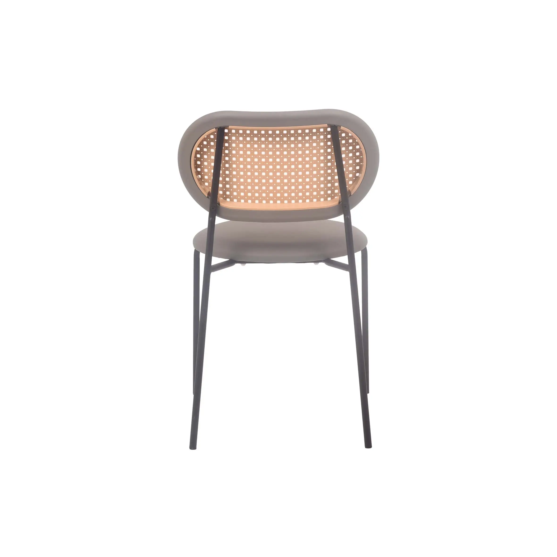 Modern interior with a sleek wooden chair, a minimalist wood and metal table, and a small plant on a textured counter. Hanging greenery adds freshness.