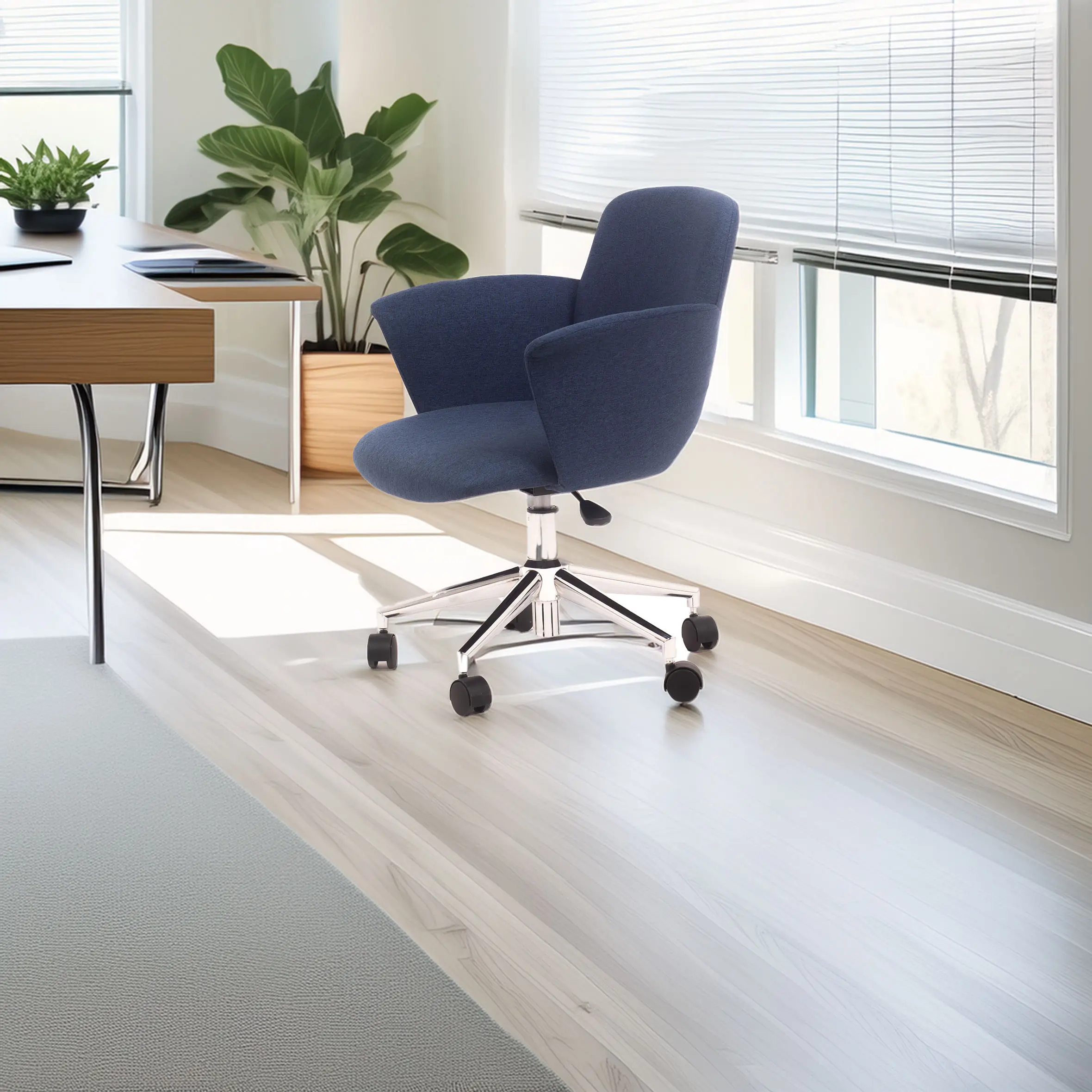 A modern office chair with blue upholstery and chrome wheels on a light wood floor. Sunlight streams through blinds, illuminating a desk and green plants.