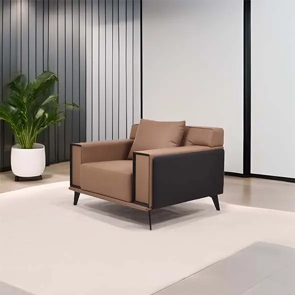 A modern armchair with brown cushions and black sides sits on a beige rug. A lush green plant is in a white pot beside a wall with vertical panels.