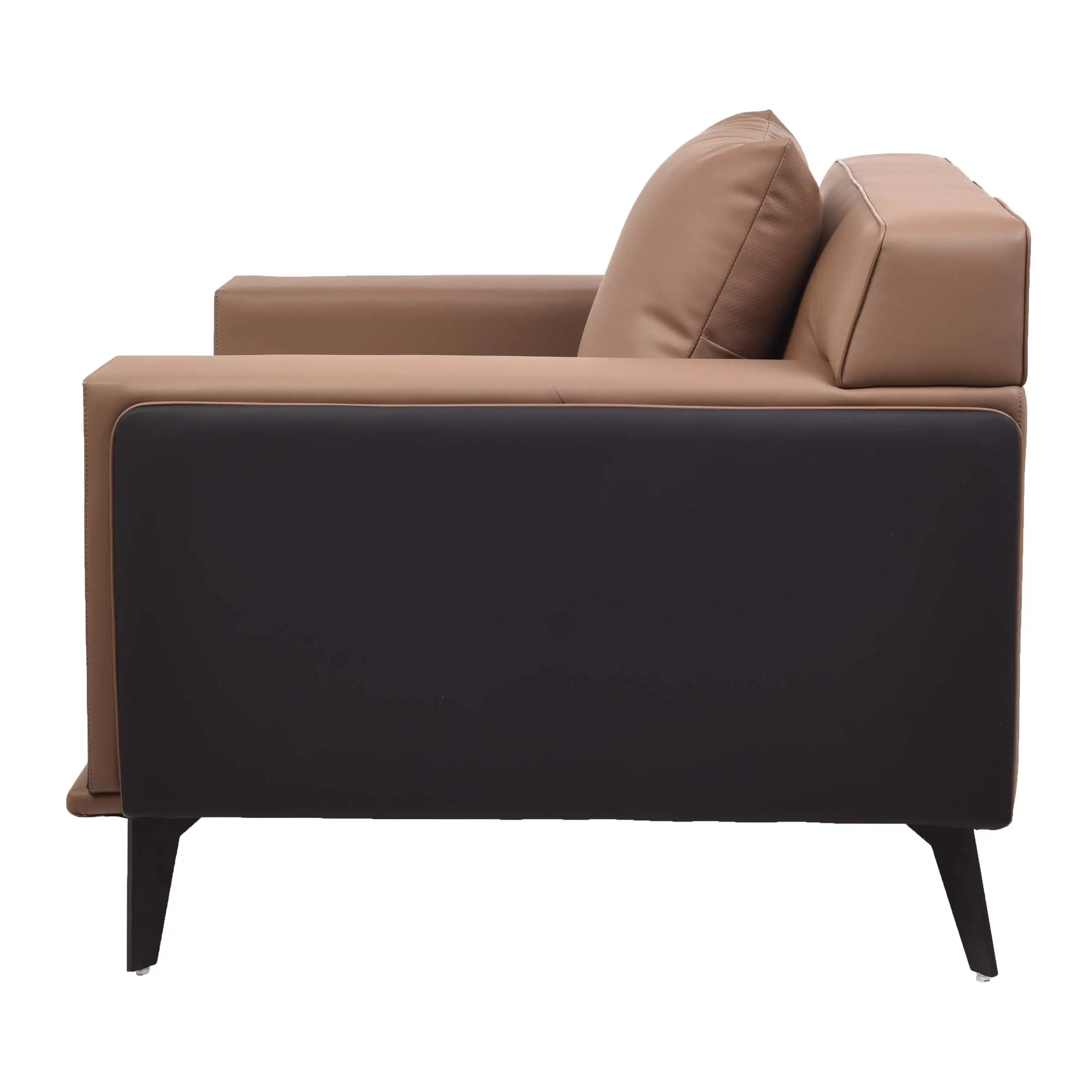 A modern armchair with brown cushions and black sides sits on a beige rug. A lush green plant is in a white pot beside a wall with vertical panels.