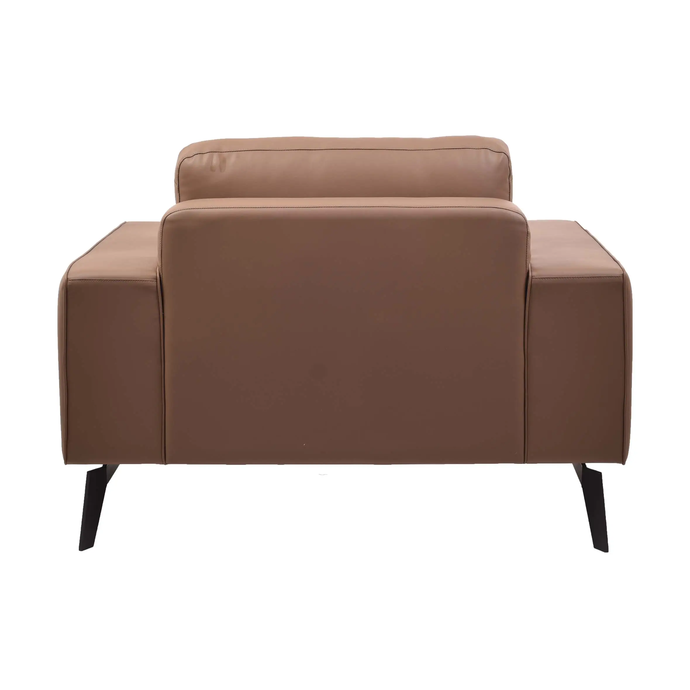 A modern office space with a brown leather sofa on a white rug, wooden floor, glass windows, and a sleek desk with a laptop. A calm, professional ambiance.