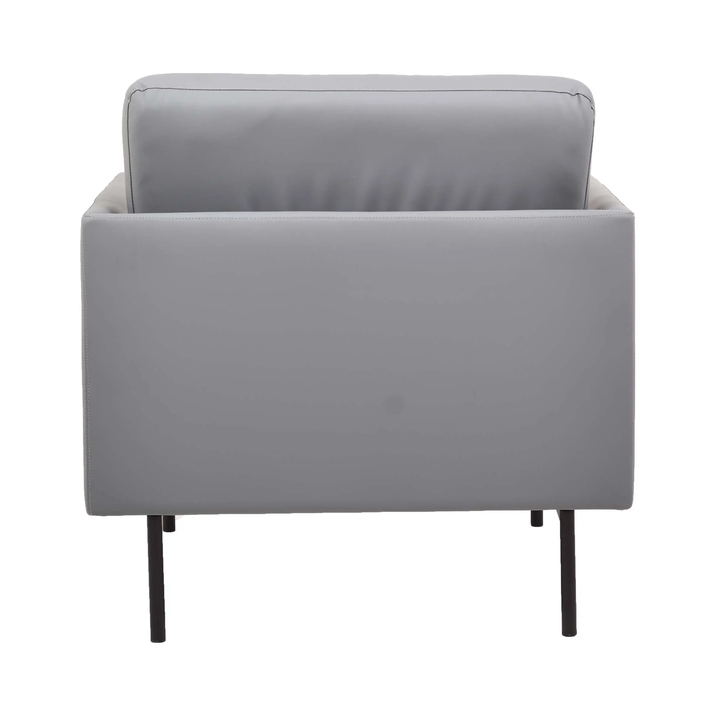 A modern office space featuring a gray armchair against a white wall, wooden paneling, and potted plants. The scene conveys a calm, minimalist vibe.