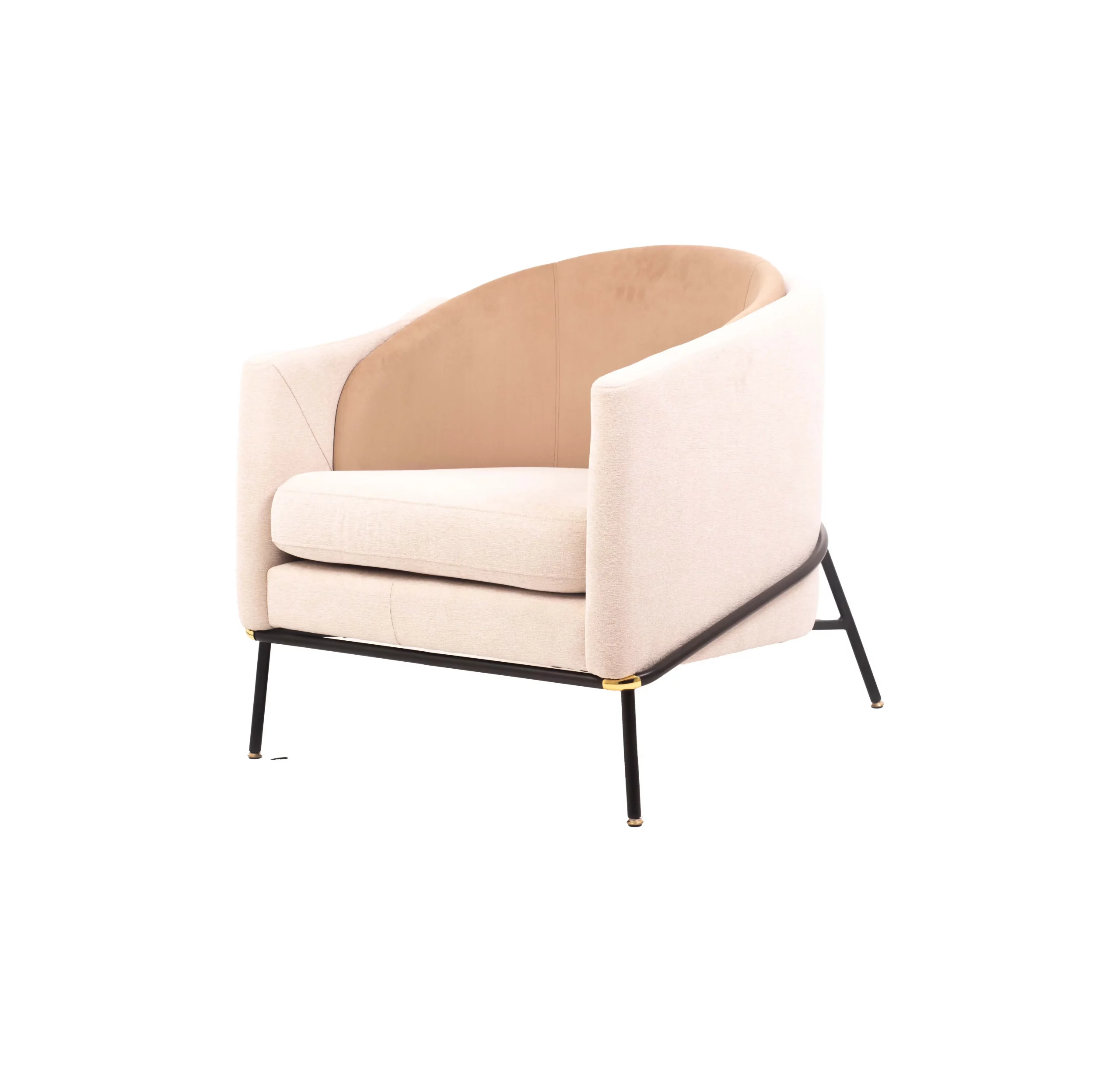 A modern beige armchair with black legs rests on a light gray rug. A round table with stacked magazines and a vase with dried flowers is beside it.