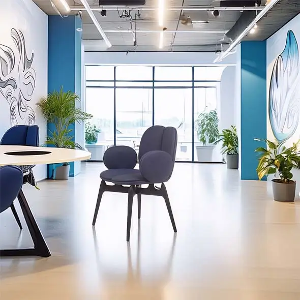 Modern office space with blue chairs, abstract wall art, and large windows. Potted plants and sleek design create a fresh, inviting atmosphere.