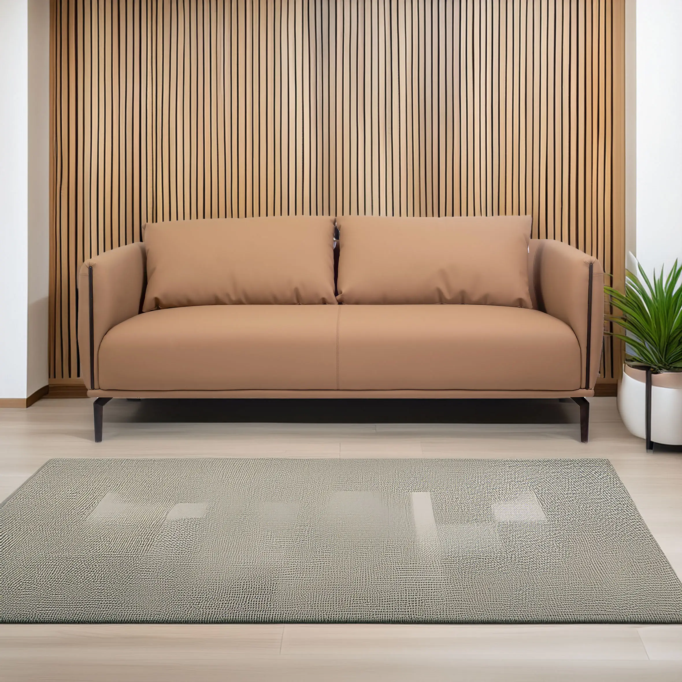 A modern, minimalist living room with a beige sofa in front of a wooden slatted wall. A textured rug is on the floor, and a green plant is beside the sofa.