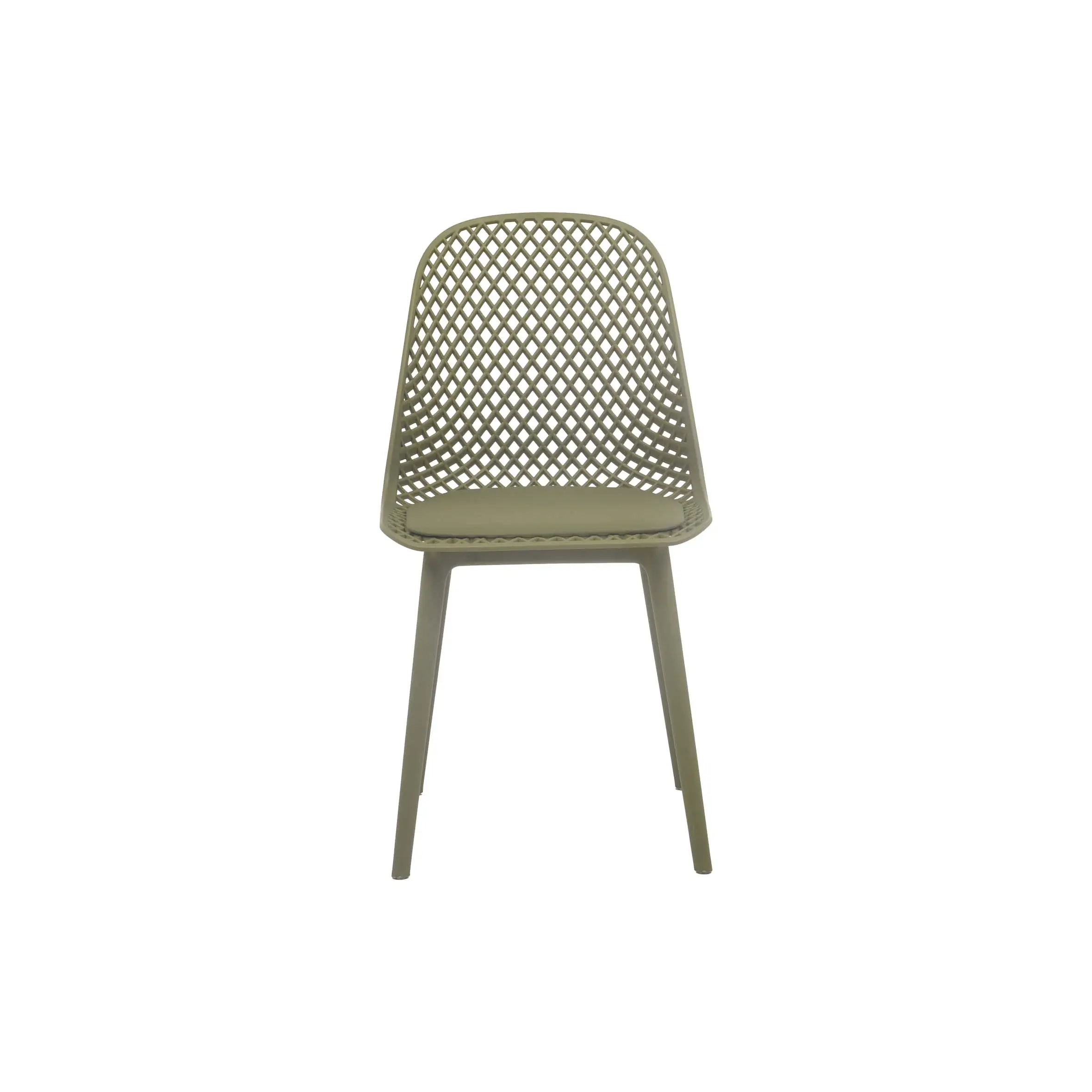 Bright office space with a round white table, four green mesh chairs, and large potted plants by tall windows, creating a fresh, airy atmosphere.