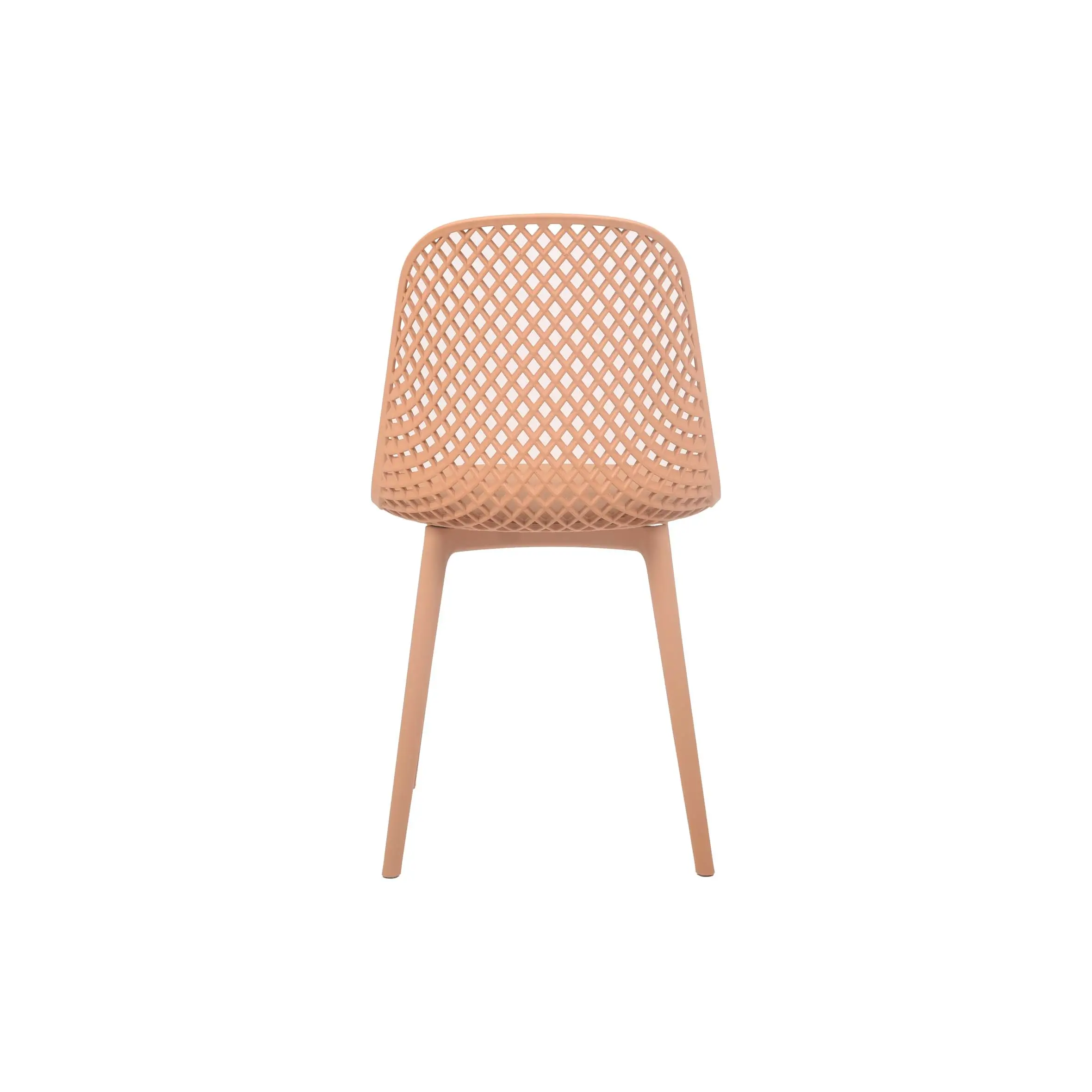 Modern cafe interior with peach-colored, perforated chairs around a table. Large, round pendant lights hang above. Numerous potted plants line the tall windows, creating a fresh and airy atmosphere.