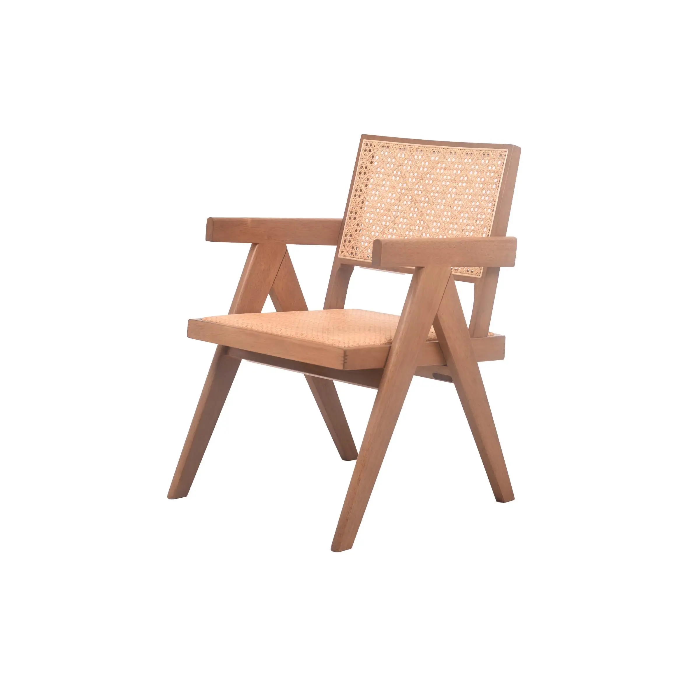 A minimalist room features a wooden chair with woven rattan details beside large windows. Nearby, a lush potted plant adds greenery. The space feels serene.