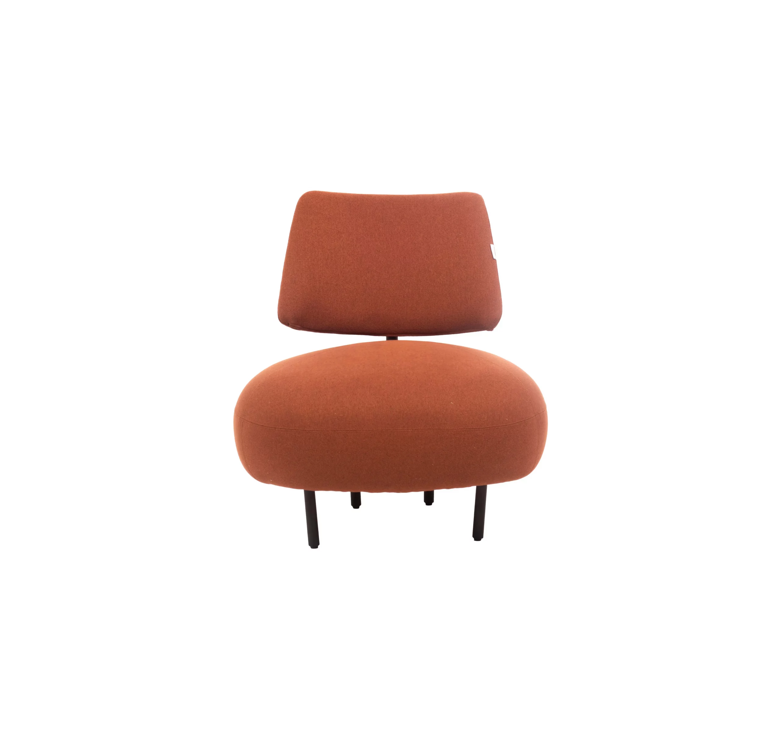 A modern room with a brick wall, featuring a round orange chair on a striped rug. A plant and books are on a shelf. Sunlight streams through a large window.