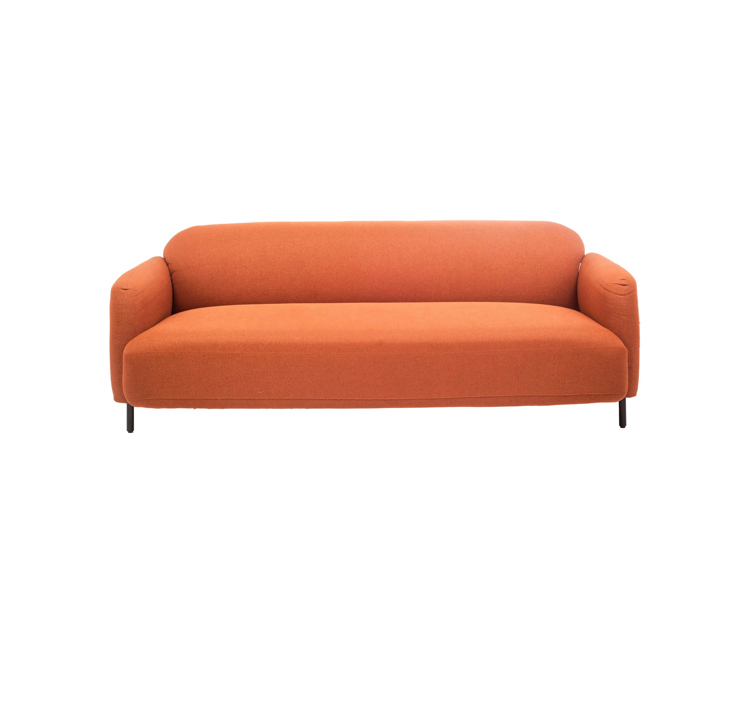 Orange sofa in a sleek modern office with large windows, gray rug, plants, and city view. Minimalist and cozy ambiance with a neutral palette.