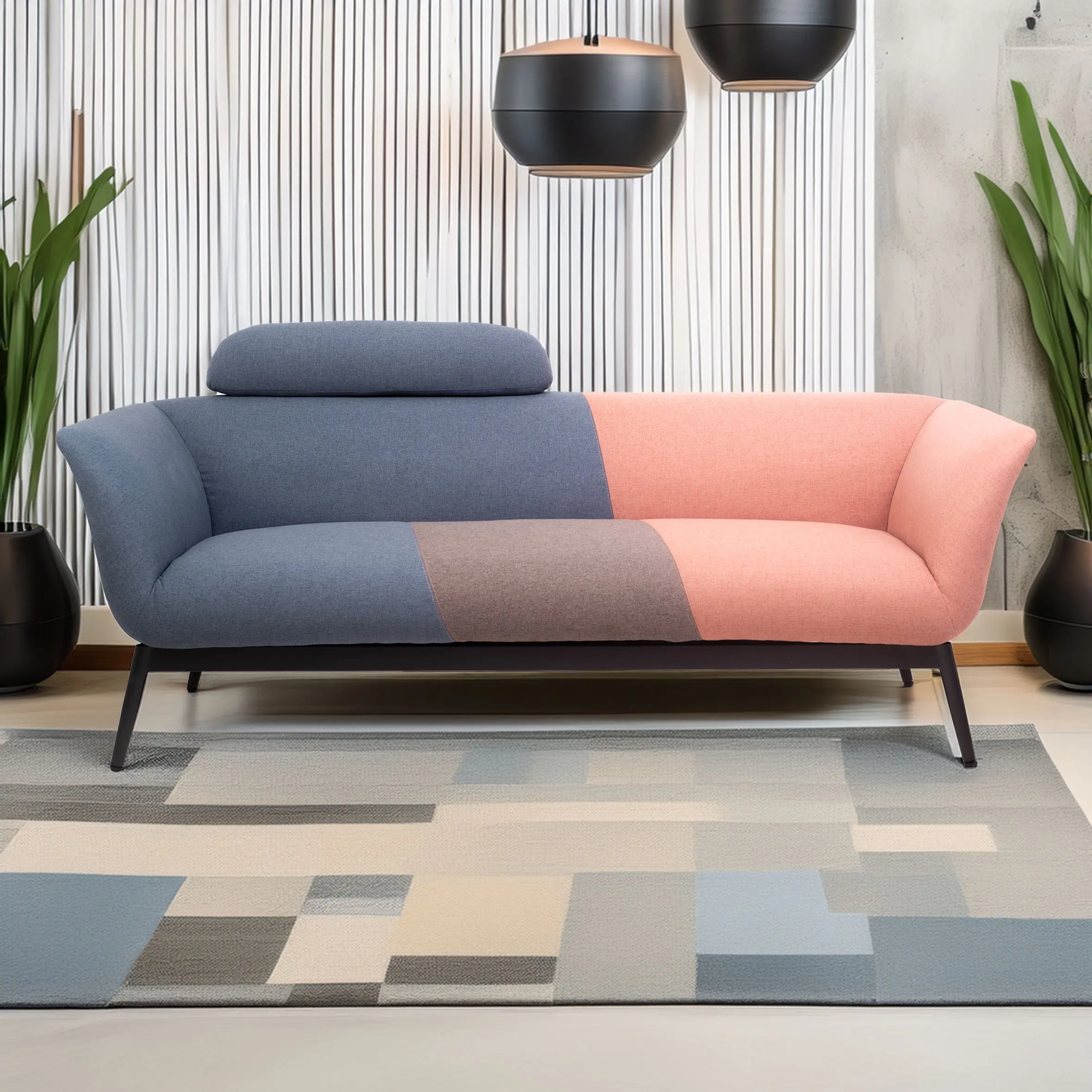 Colorful modern sofa with pink, brown and blue patchwork design. It's set against a minimalist backdrop, flanked by green plants and black pendant lights.