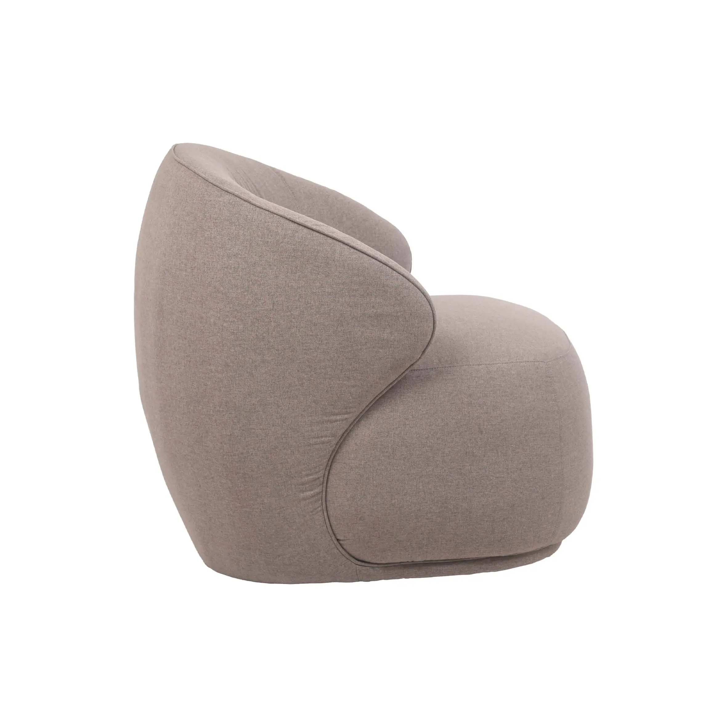 A cozy, modern room with a gray curved armchair on a round beige rug. Tall green plants in white pots and large windows create a bright, serene atmosphere.