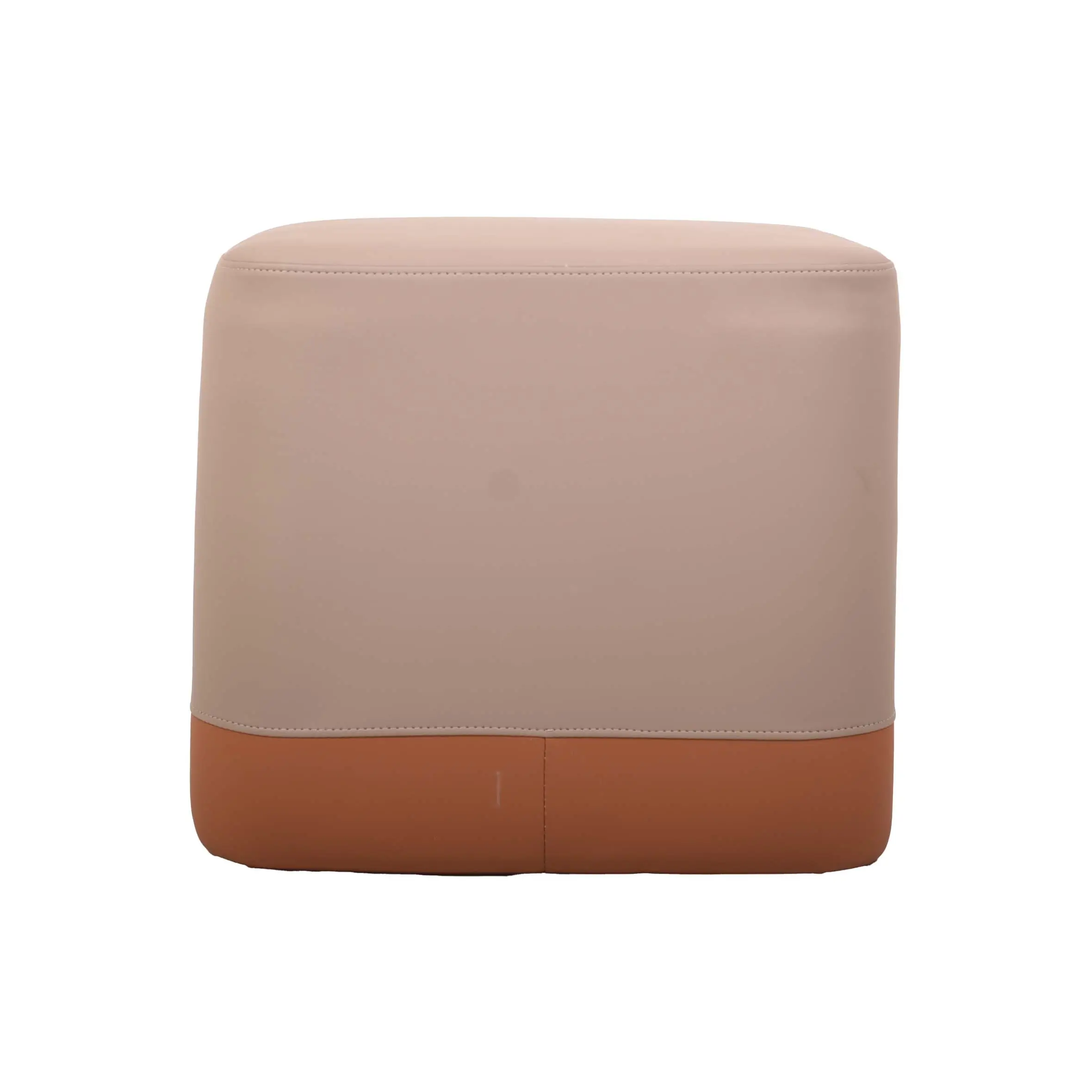 A modern, beige and orange ottoman sits on a textured gray carpet. Nearby are a wooden table and a potted plant, creating a cozy, minimalist setting.