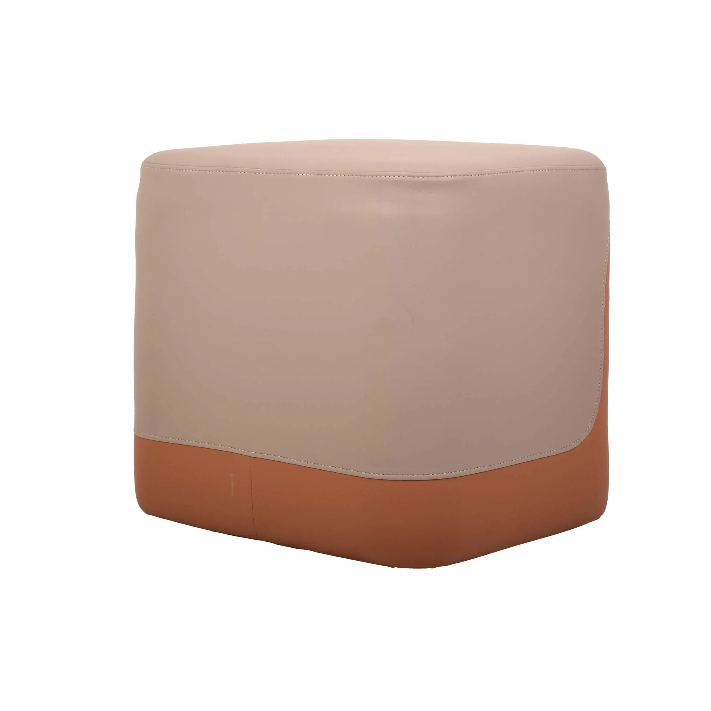 A modern, beige and orange ottoman sits on a textured gray carpet. Nearby are a wooden table and a potted plant, creating a cozy, minimalist setting.