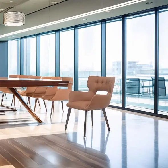 Modern office with large windows, natural light, sleek wooden table, and beige chairs. The atmosphere is calm and professional.