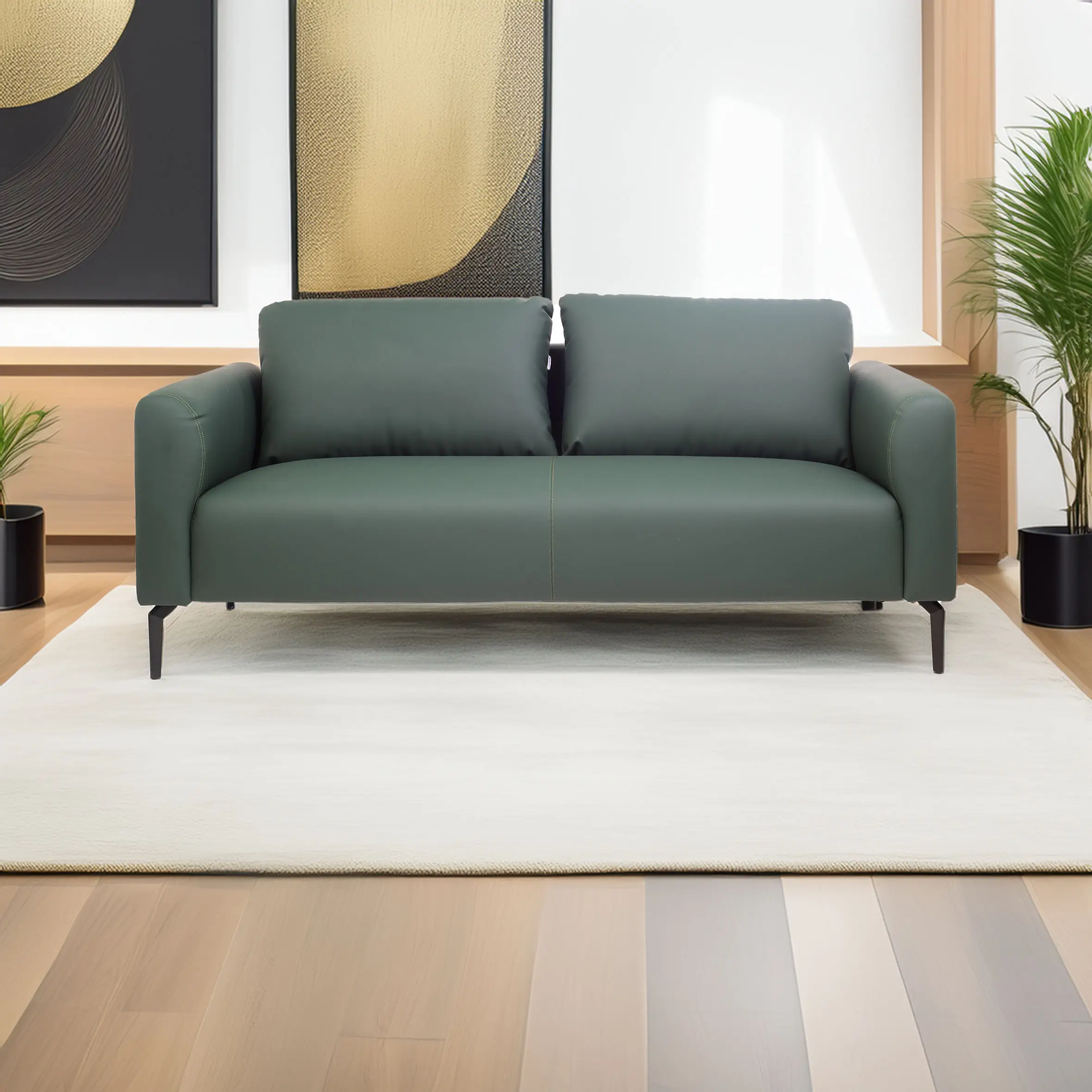 Elegant green sofa on white rug, set against modern decor with abstract black and gold artwork. Wooden floor and plants add warmth and style.