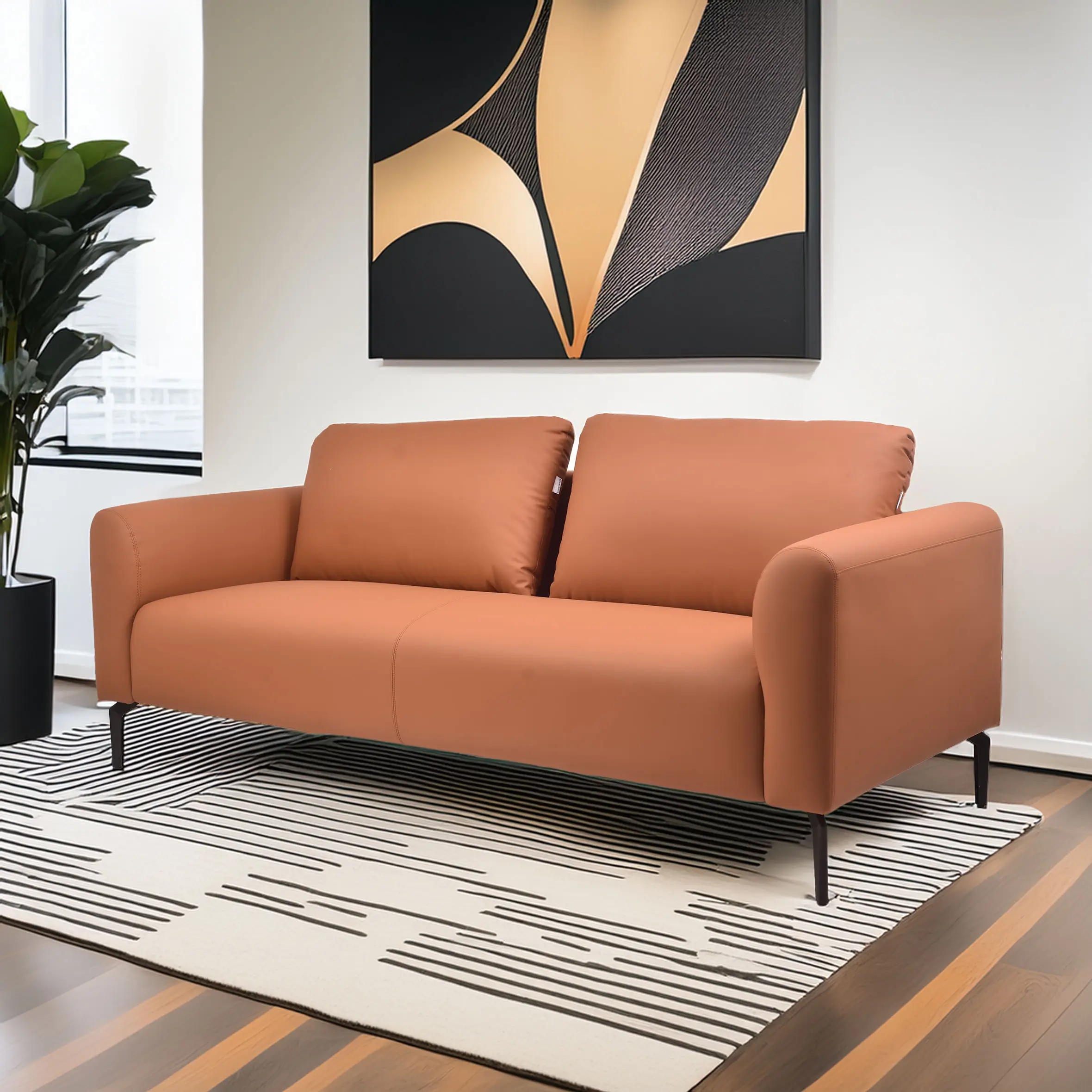 A modern living room with a terracotta sofa on a striped rug. A large abstract painting hangs above; a plant is near a window, creating a cozy vibe.