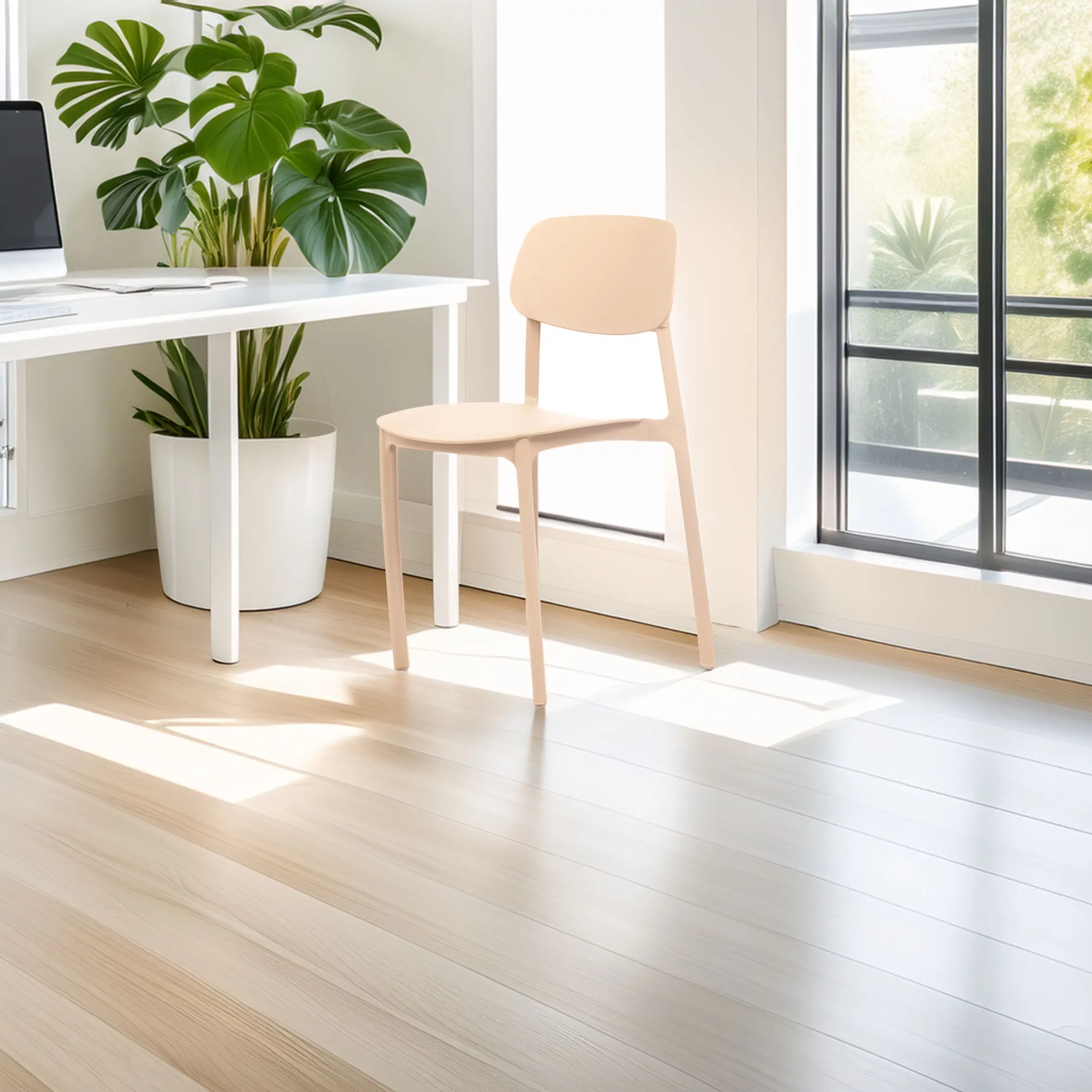 Bright minimalist room with light wood flooring, a modern white desk, and a beige chair. Large green plant and sunlight stream through tall windows.
