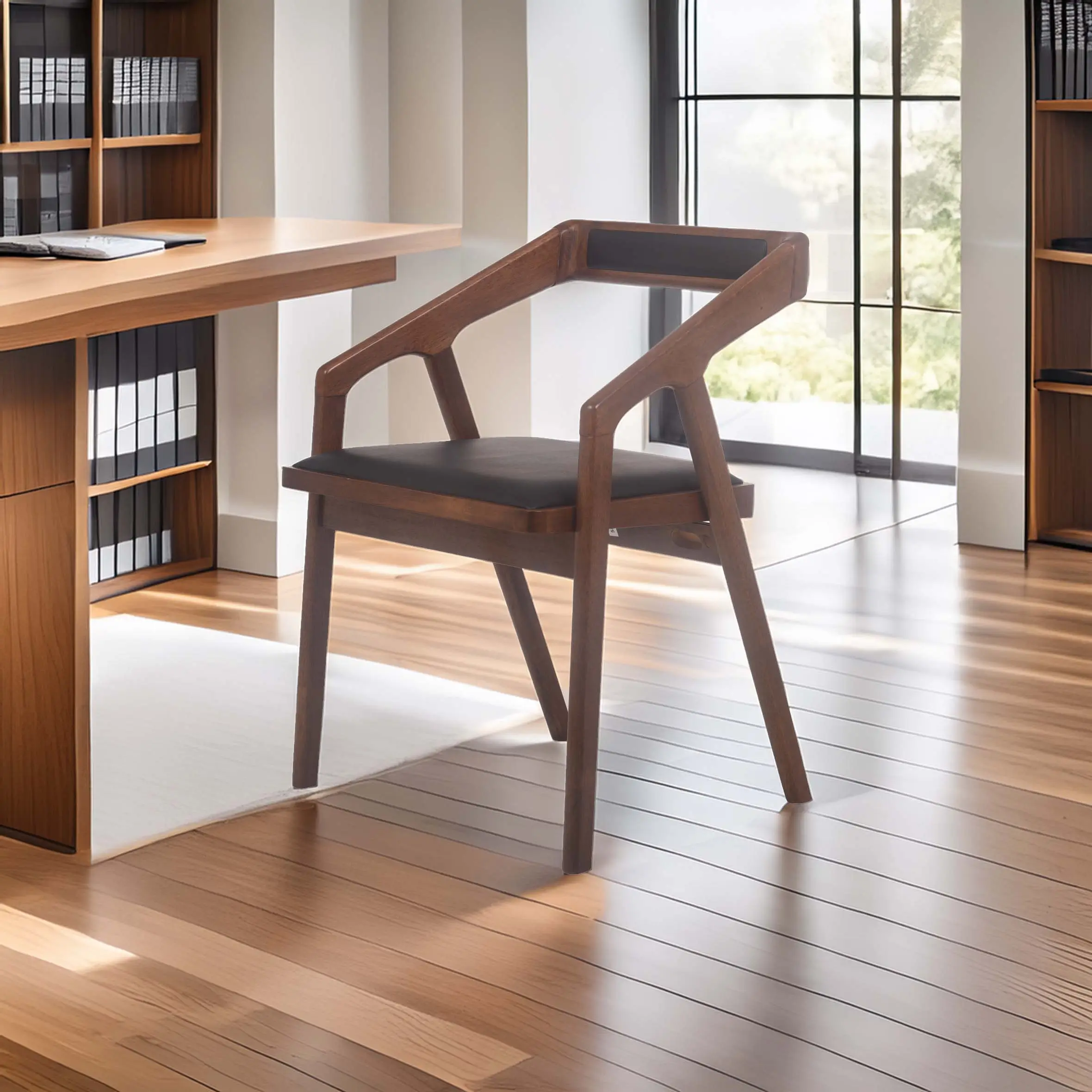 A modern wooden chair with a black cushion sits on polished wooden floors in a bright room, alongside a wooden desk and shelves, evoking a sleek, minimalist design.