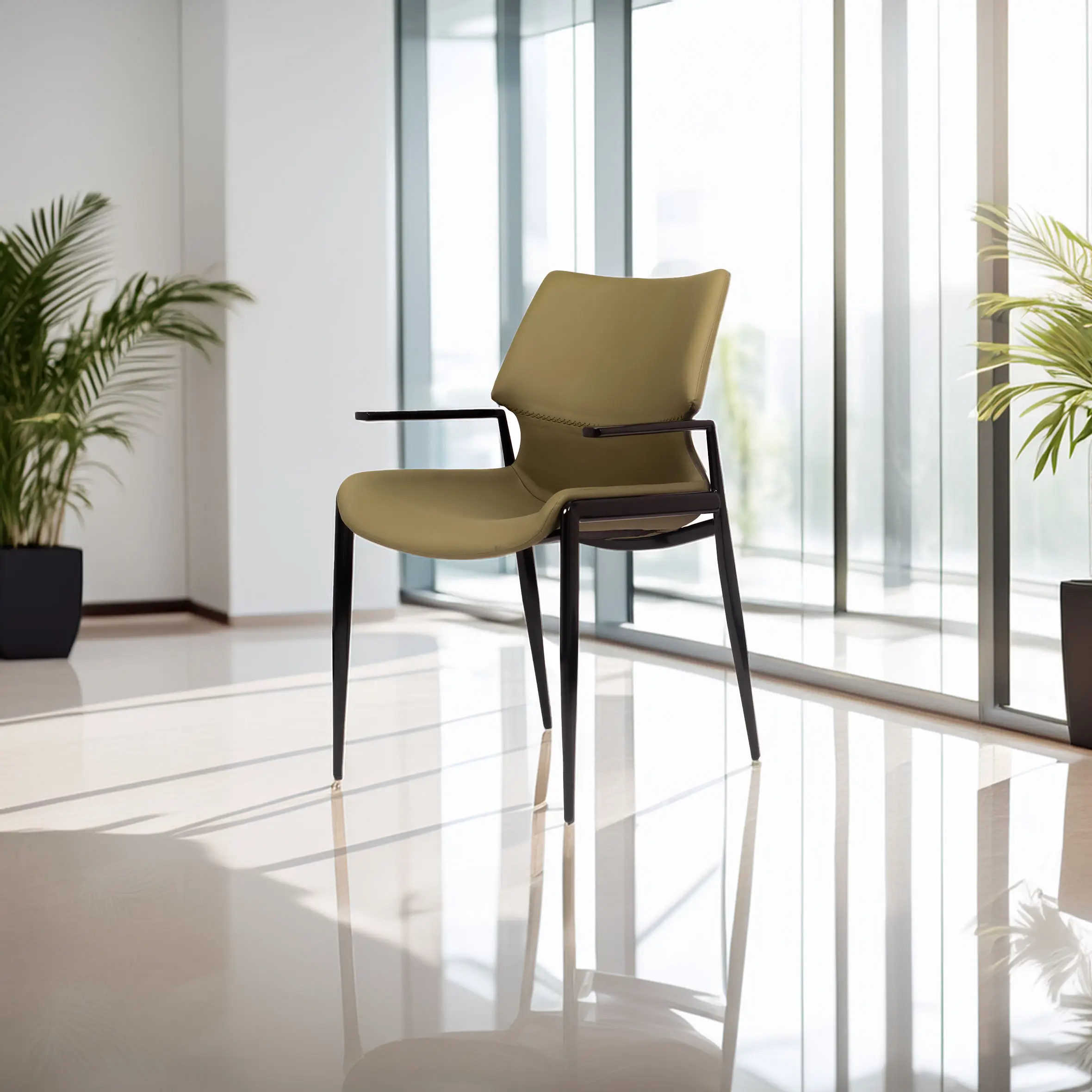 A modern olive-green chair with black legs is placed in a bright, minimalist room with large windows. Two potted plants add a touch of greenery.