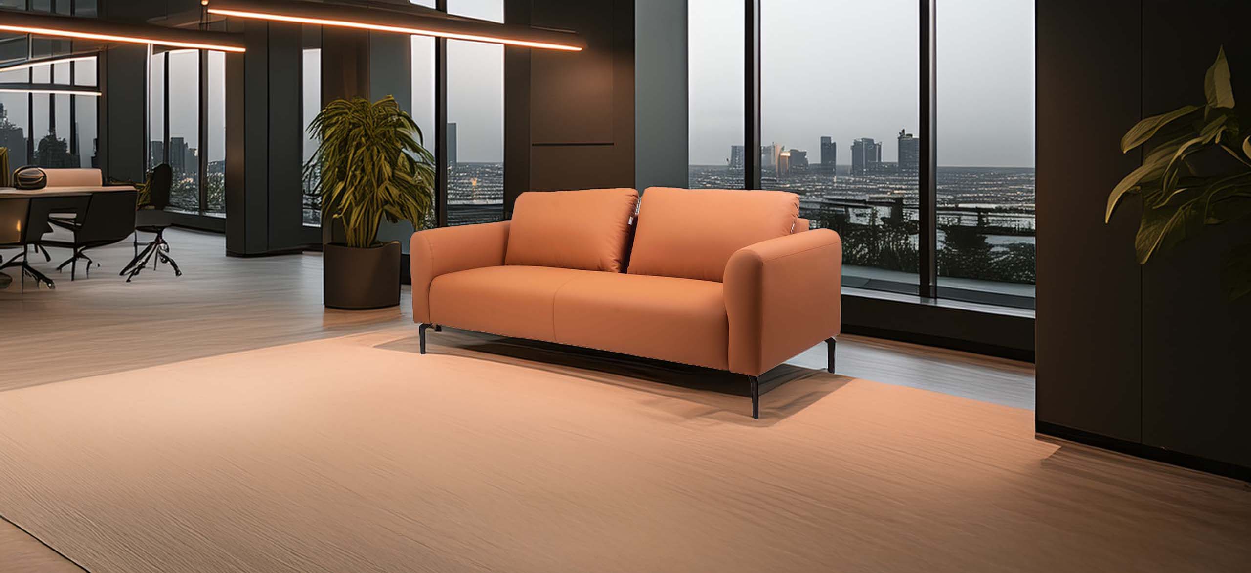 Cozy brown sofa in a modern office with floor-to-ceiling windows, offering a city view.