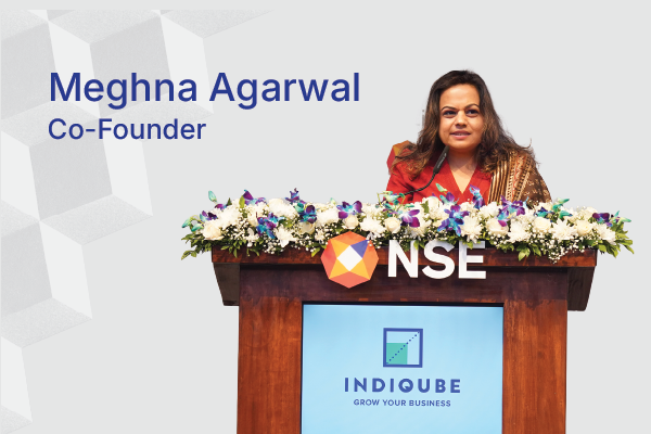 IndiQube team celebrating the company’s listing ceremony at the National Stock Exchange (NSE) with a bell-ringing event and confetti on stage.